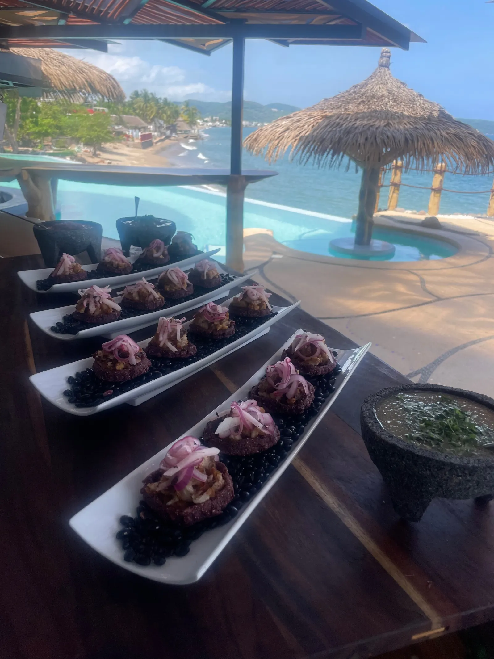 Full feast spread at La Puesta del Sol's oceanfront dining area